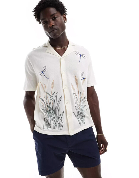 ASOS DESIGN relaxed knitted button through polo with dragonfly embroidery in ecru