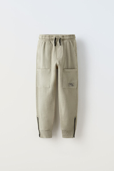 Plush trousers with zips