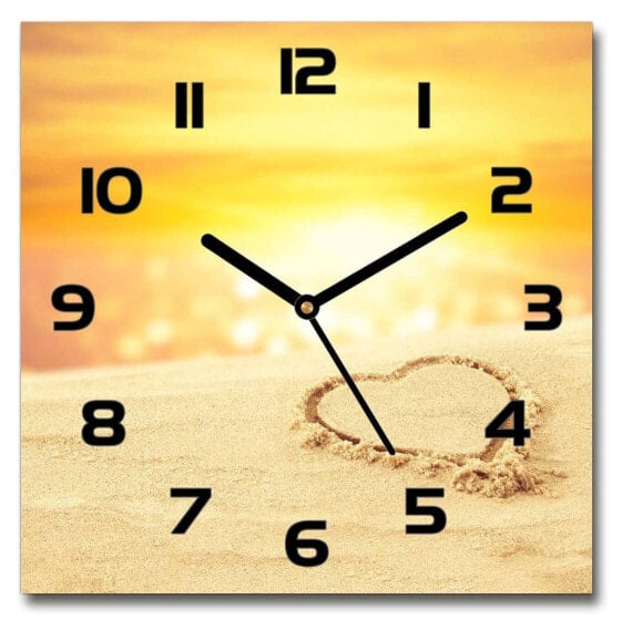 Wanduhr Herz auf dem Sand