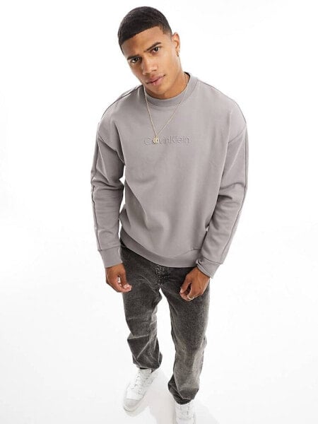 Calvin Klein embossed logo comfort sweatshirt in 