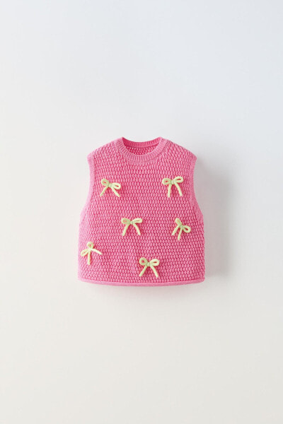 Knit top with contrast bows