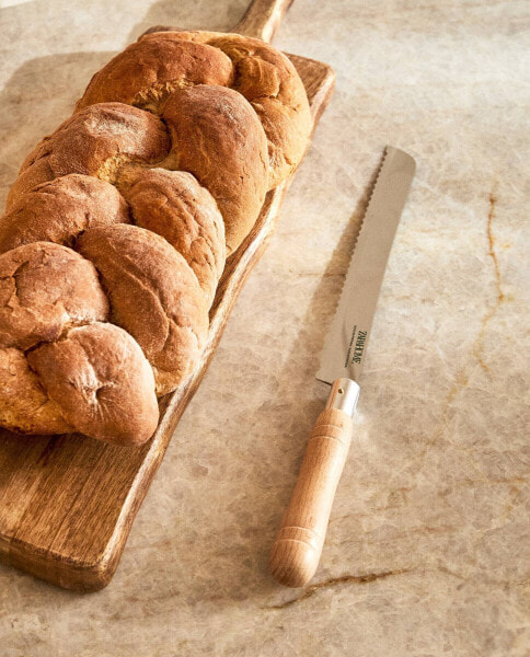 Serrated bread knife with wooden handle