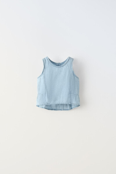 Denim top with ruffled back