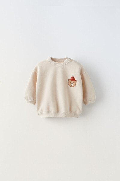 Sweatshirt with embroidered bear