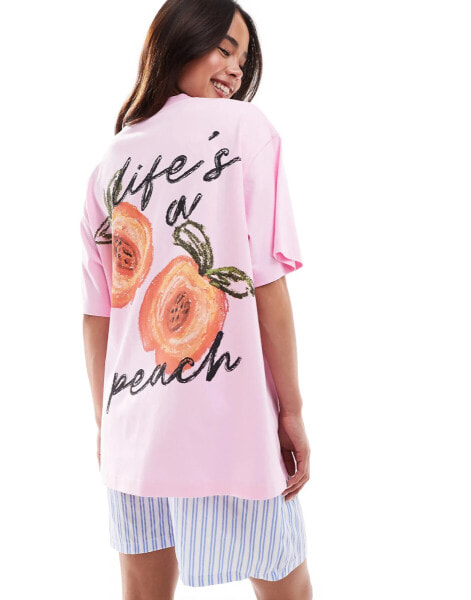 ASOS DESIGN oversized t-shirt with peach back graphic in pink