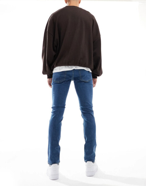 JJ Rebel luke slim fit jeans in mid blue wash