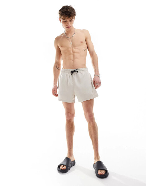 COLLUSION shorter length swim short in stone