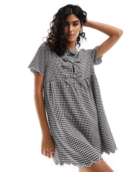 The Frolic bow detail gingham smock dress in black and white