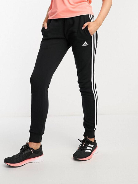 adidas Sportswear essentials 3 stripes joggers in black and white