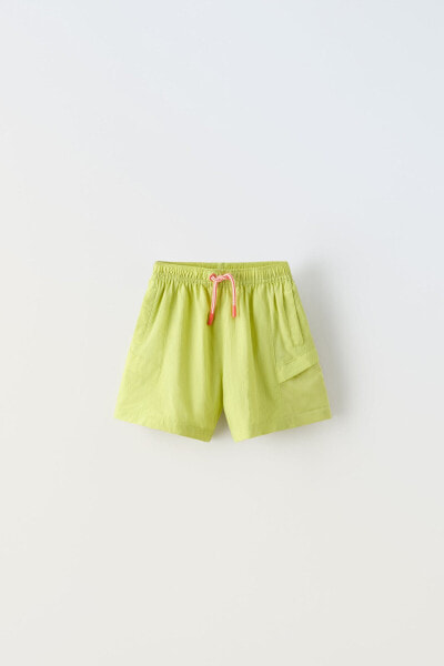 Water-repellent bermuda shorts with contrast drawstrings
