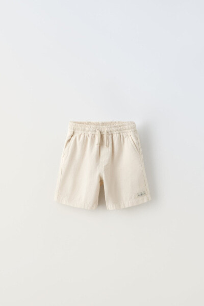 Bermuda shorts with label