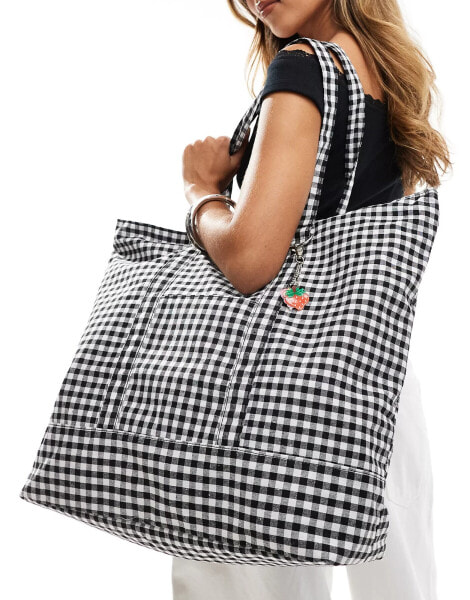 SVNX gingham tote bag with removable key charms in black and white