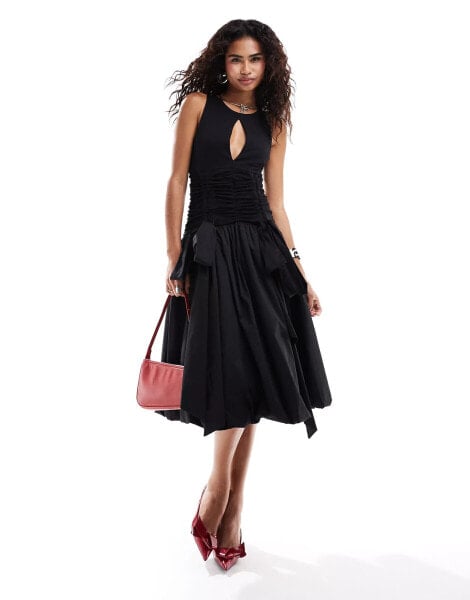 Amy Lynn Bodhi slash cut out puffball midi dress in black