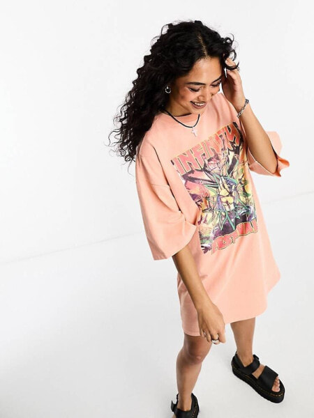 ASOS DESIGN oversized t-shirt with festival graphic in pink