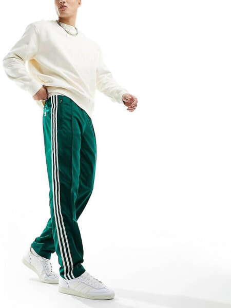 adidas Originals archive track pants in green and off white