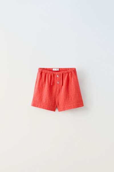 Dotted mesh bermuda shorts