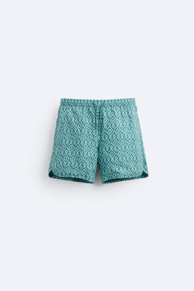 Long geometric print swimming trunks