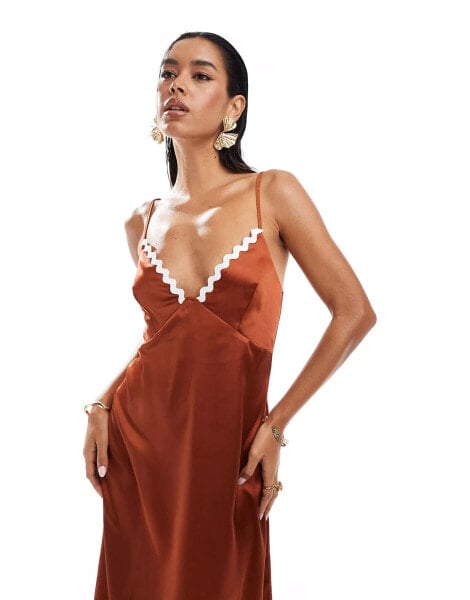 ASOS DESIGN satin midi slip dress with contrast rik rak trim in rust