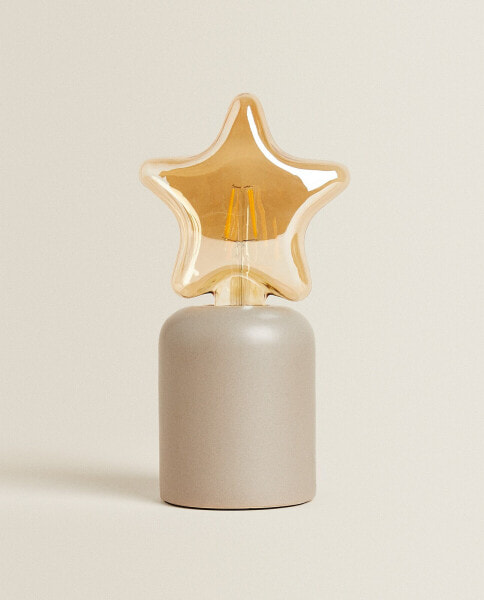 Children’s table lamp with star light bulb