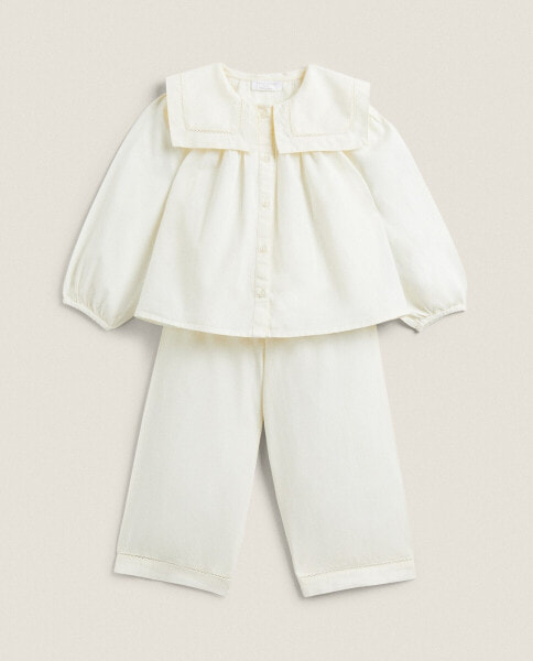 Baby set of pyjamas with embroidered collar