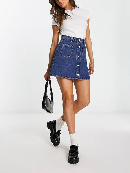 Monki denim button through mini skirt in mid blue wash