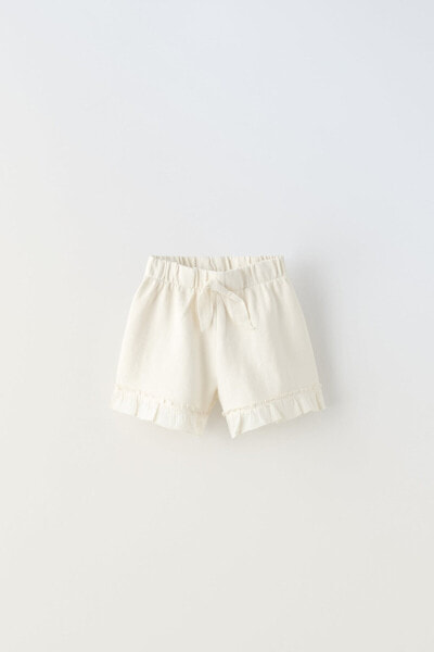 Plush bermuda shorts with bow and ruffles