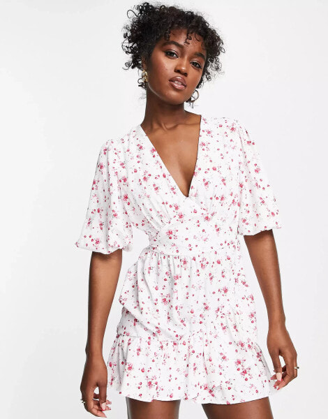 In The Style x Perrie Sian puff sleeve frill wrap detail mini dress in white ditsy print