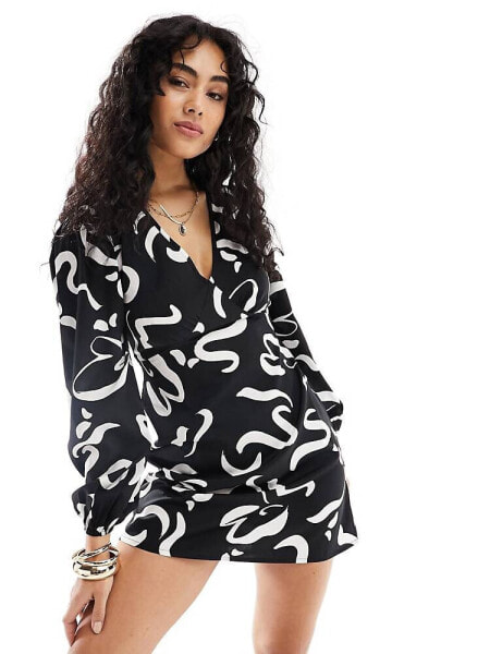 Wednesday's Girl deep v swirl print mini dress in black and white