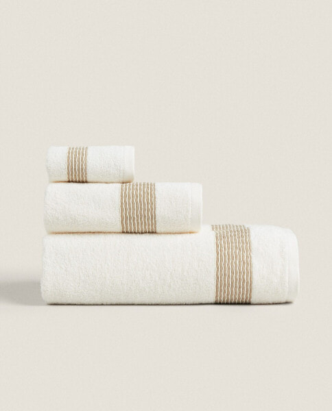 Cotton towel with pleated border