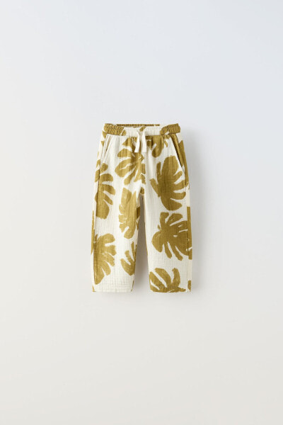 Textured leaf print trousers