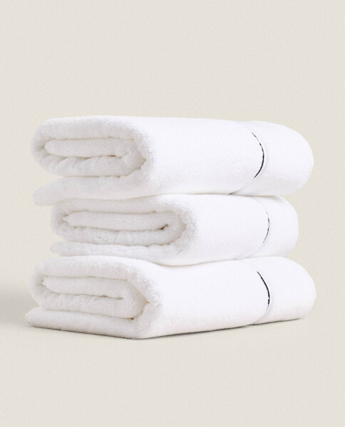 Embroidered scalloped edge towel