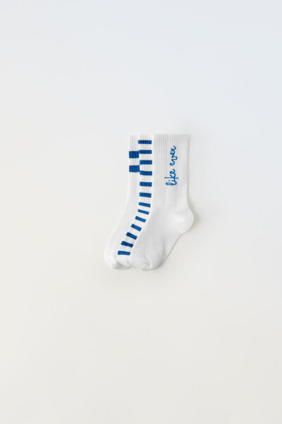 Pack of three pairs of long striped and slogan socks