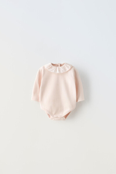 Contrast bodysuit with ruffle detail