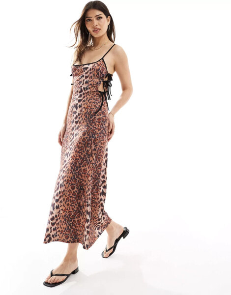 ASOS DESIGN strappy midi dress with cutout sides and bow detail in animal print