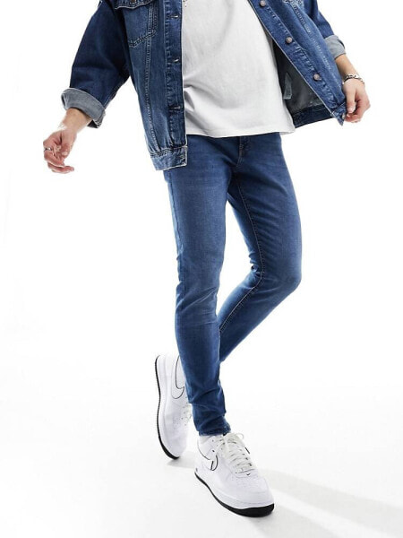 Jack & Jones pete tapered jeans in mid blue