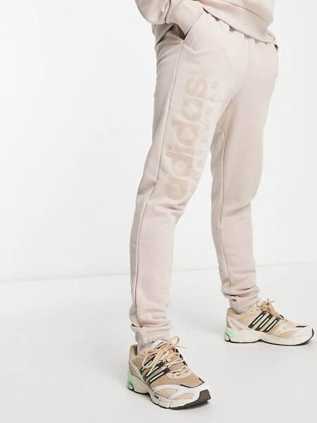 adidas Sportwear Lounge joggers in brown