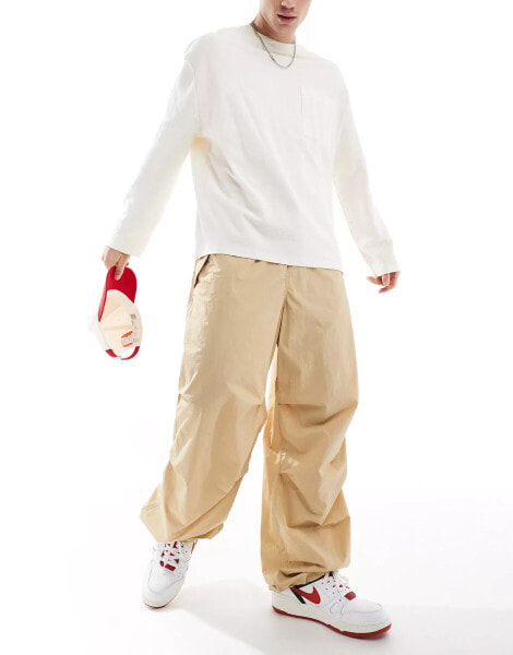 Tommy Jeans nylon parachute pants in beige