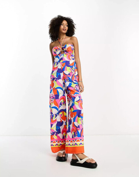 River Island – Bandeau-Jumpsuit mit abstraktem Print in leuchtendem Blau