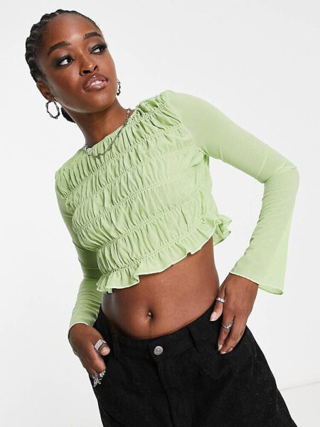 The Frolic shirred fluted sleeve crop blouse in sap green