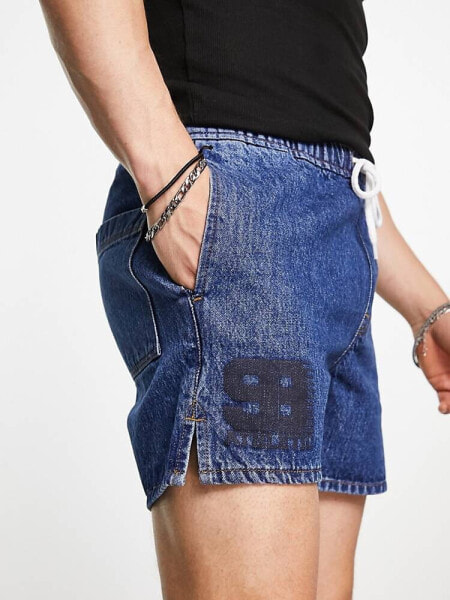 ASOS DESIGN pull on shorter length denim shorts in mid wash blue