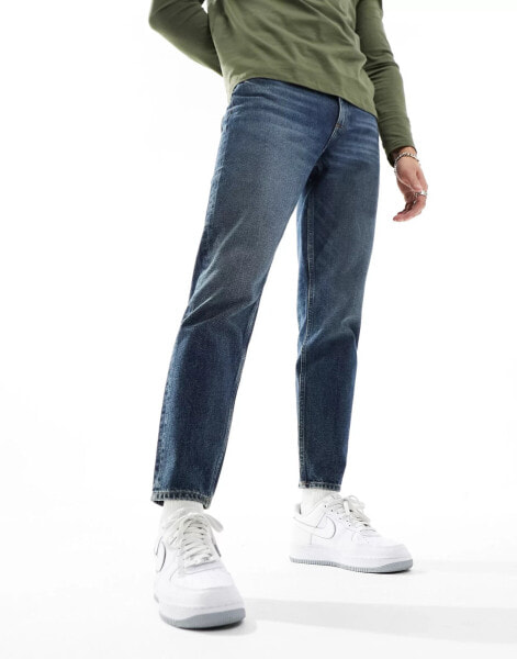 ASOS DESIGN tapered fit jeans with tinted dark wash - MBLUE