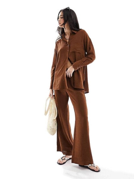 The Frolic tourmaline beach trouser co-ord in dark brown