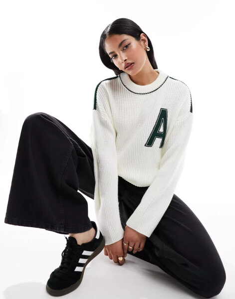 ASOS DESIGN crew neck varsity jumper in cream