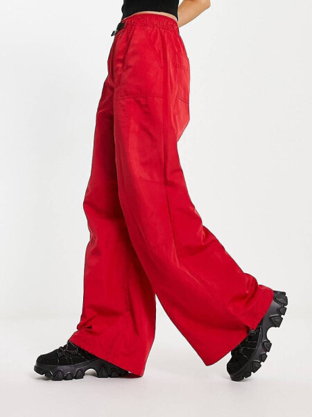 ASOS DESIGN parachute cargo trouser with belt detail in techy fabric in red