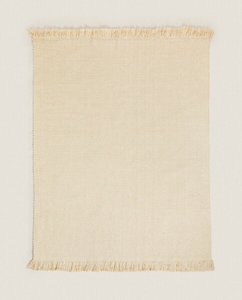 Rectangular wool rug with fringing