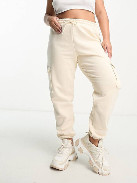 River Island Plus cargo trouser with pocket detail in beige 