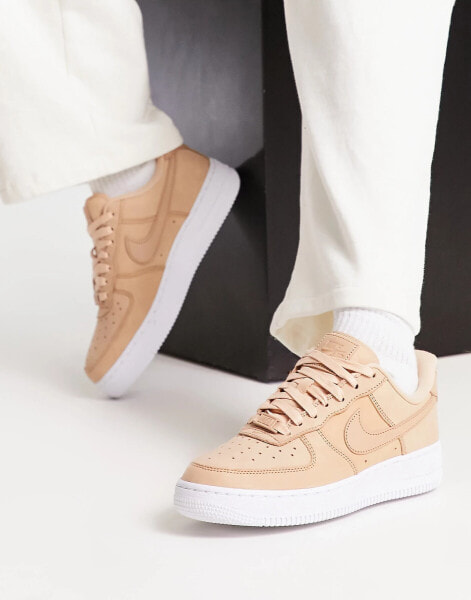 Nike Air Force 1 trainers in tan