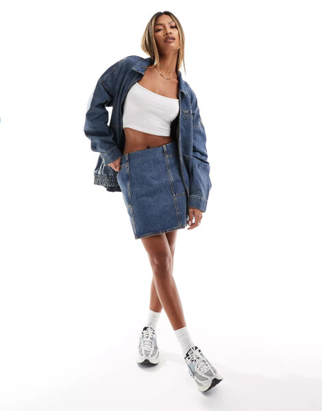 ASOS Weekend Collective denim mini skirt in mid blue wash