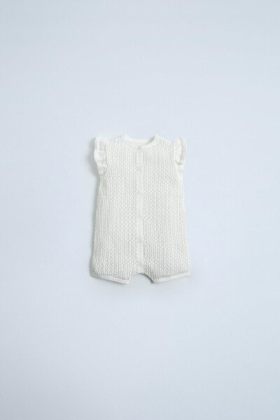 Short textured dungarees with ruffles