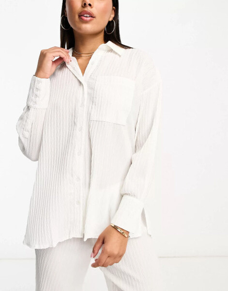 The Frolic tourmaline shirred long sleeve shirt beach co-ord in white pleated texture